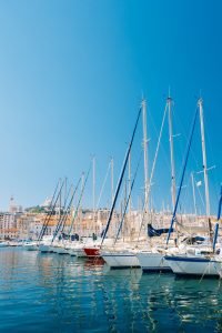 White Yachts Are Moored At City Pier, Jetty, Port In Marseille,